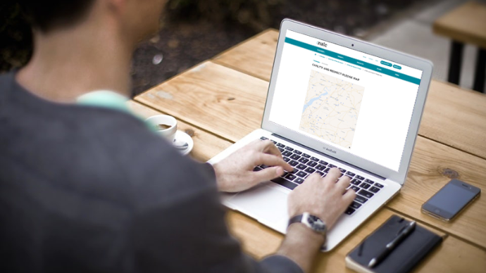 Image of laptop with the NALC website open on the page showing the map of councils that have taken the pledge